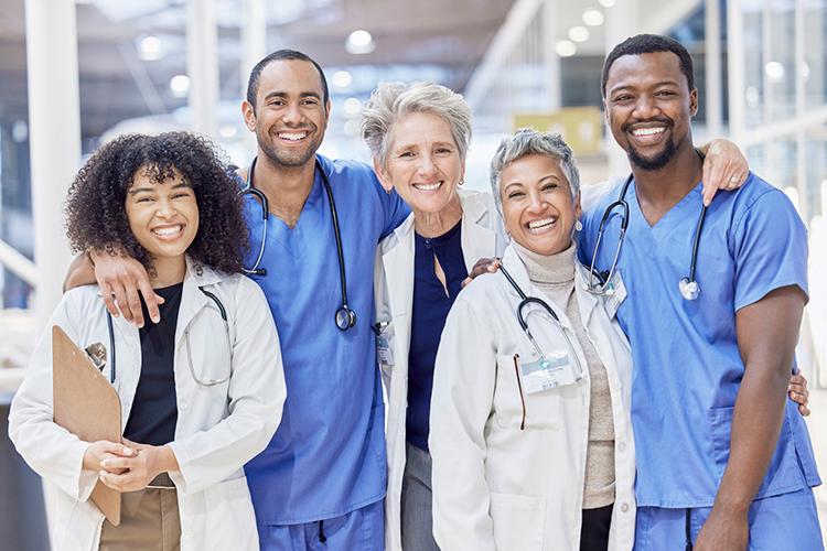 medical professionals stand together smiling